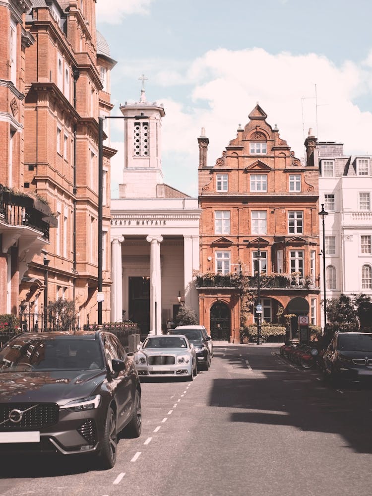 London, England | Photography of london Victorian architecture urban cityscape in Mayfair street with Bridgerton with British charm and the classic retro vintage atmosphere aesthetic of red brick city facades