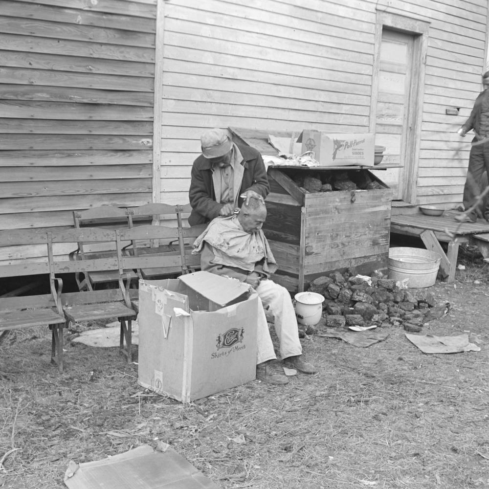 Getting A Haircut In Front Of Church Which Houses Flood Refugees, Sikeston, Missouri By Russell Lee