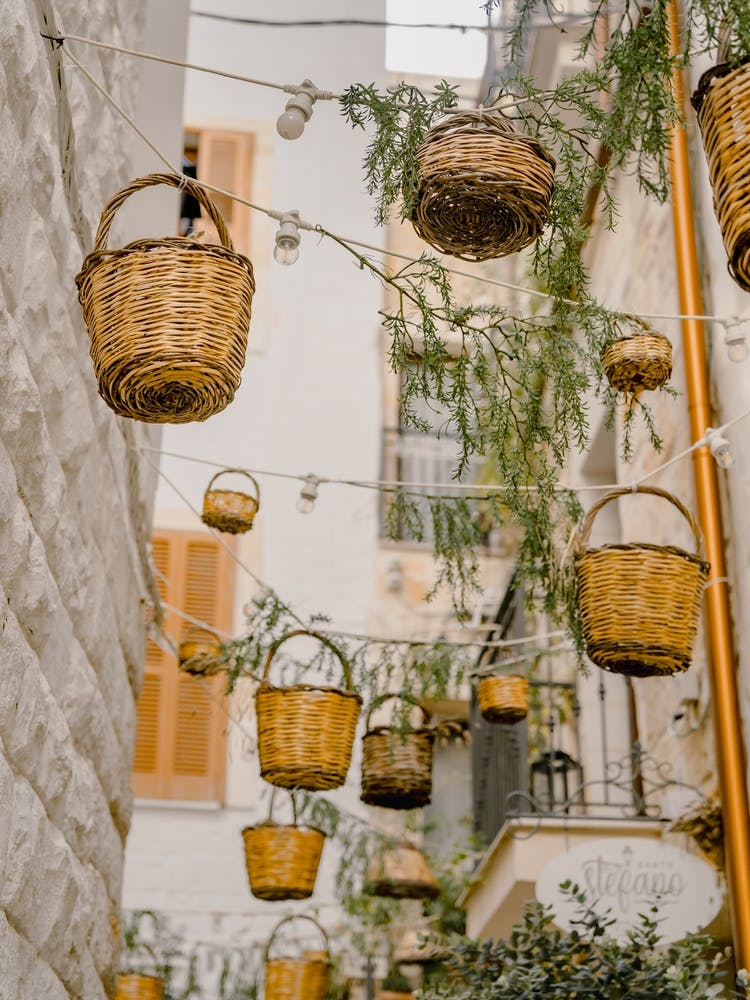 Baskets Hanging From The Ceiling in the streets of Puglia, Italy | travel photography