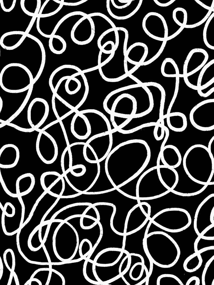 White Swirl Doodles On A Black Background