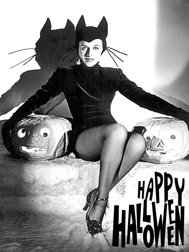 Beautiful Cat Woman Posing With Two Pumpkins