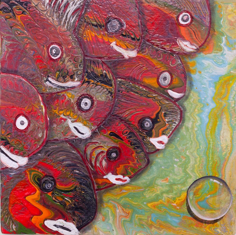 La rencontre de poissons colorés avec une bulle.