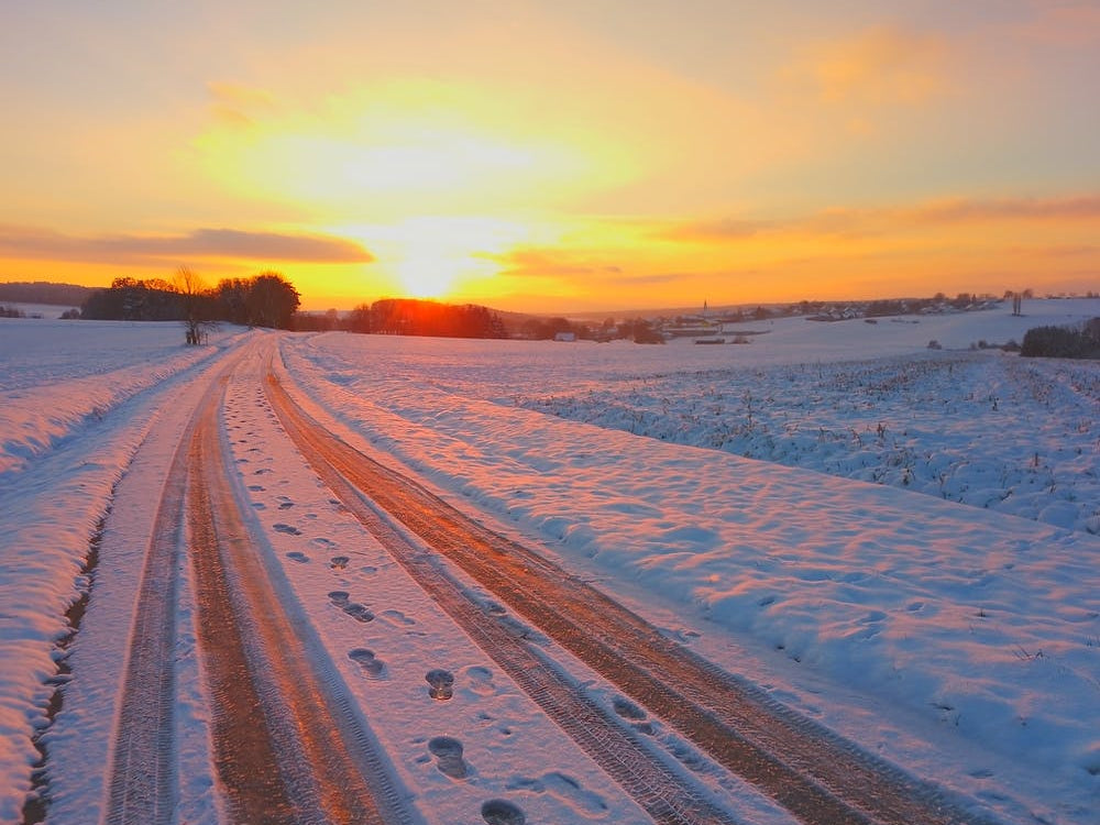 Snowy Road At Sunset