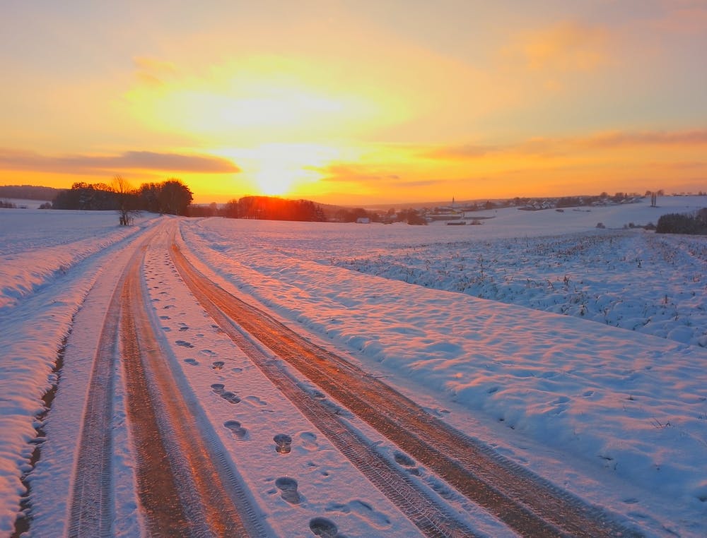 Snowy Road At Sunset