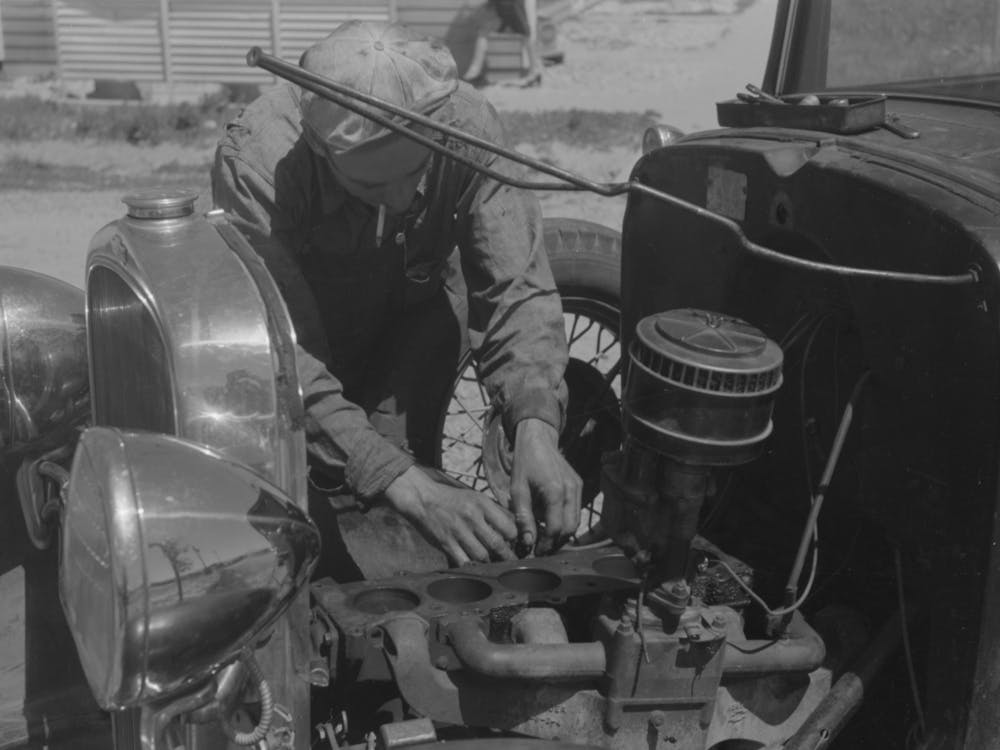 Farm Worker At Work On His Automobile, Fsa (Farm Security Administration) Labor Camp,Caldwell, Idaho By Russell Lee
