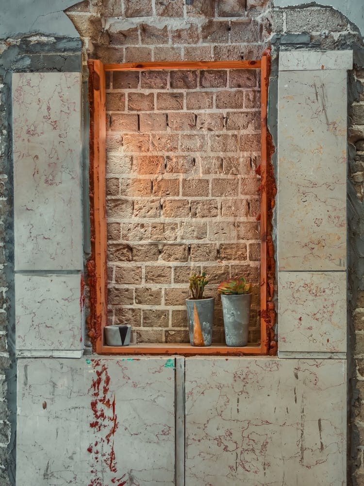 Window Sealed With Red Bricks In An Abandoned Building 3