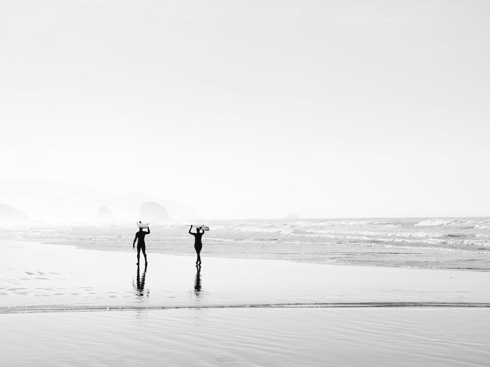 People Walking On Beach