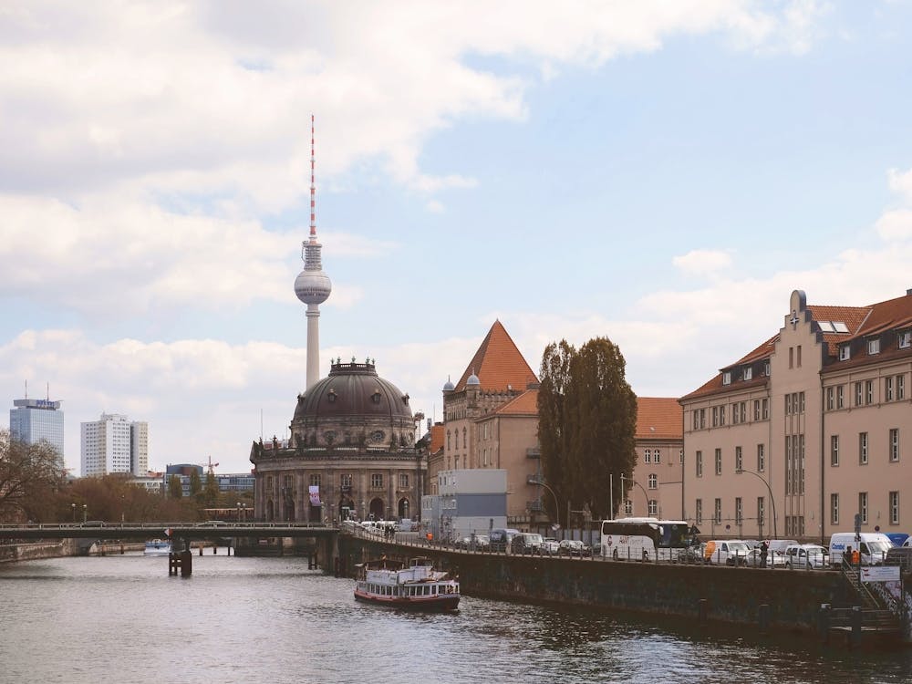 Berlin, Germany I Museum Island skyline with Bode Museum, Fernsehturm tower, Spree river reflections with moody aesthetic urban cityscape photography and calm atmosphere cinematic vintage architecture