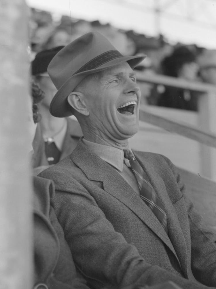 Spectator Laughing At The Antics Of A Cowboy Clown At The Rodeo Of The San Angelo Fat Stock Show, San Angelo