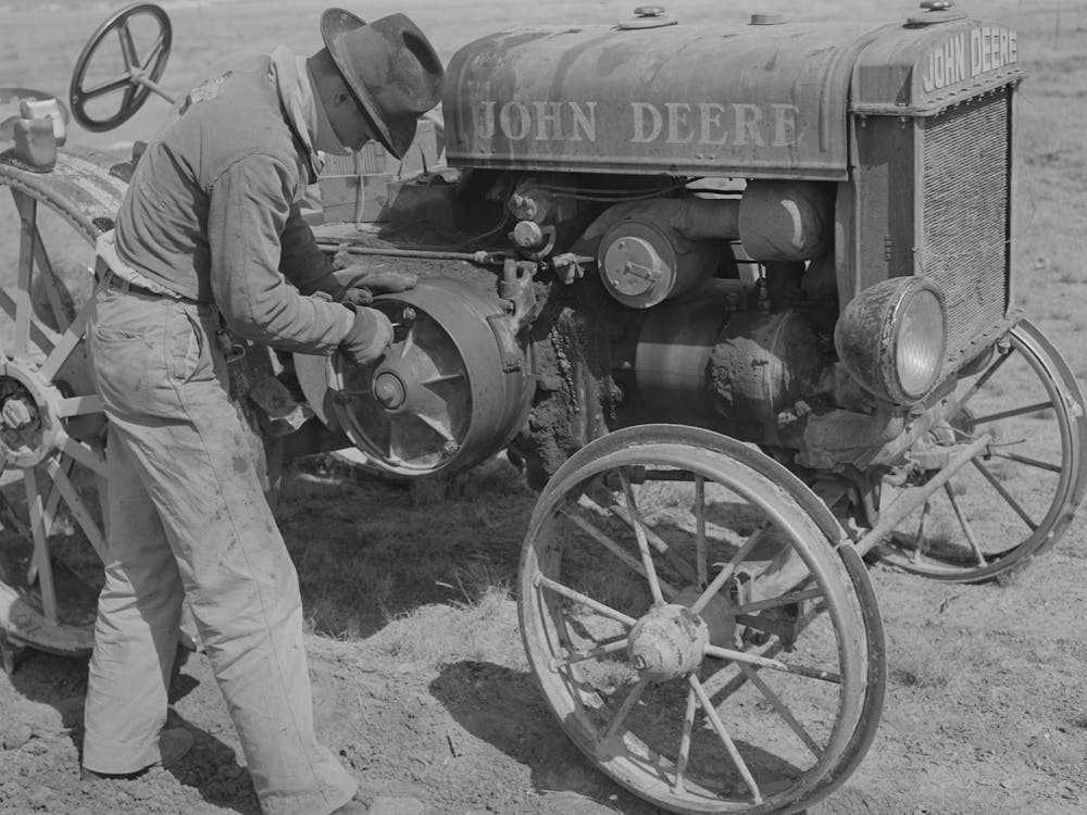 Son Of Pioneer At El Indio, Texas, Repairing Clutch On Tractor By Russell Lee