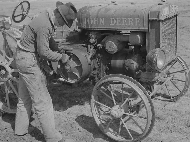 Son Of Pioneer At El Indio, Texas, Repairing Clutch On Tractor By Russell Lee