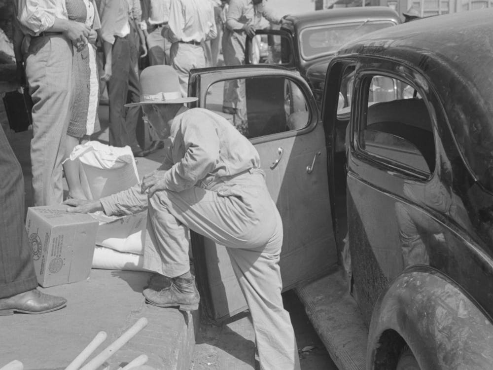 Untitled Photo, Possibly Related To Grocery Clerk Putting Broom And Other Supplies In Back Of Automobile, Saturd
