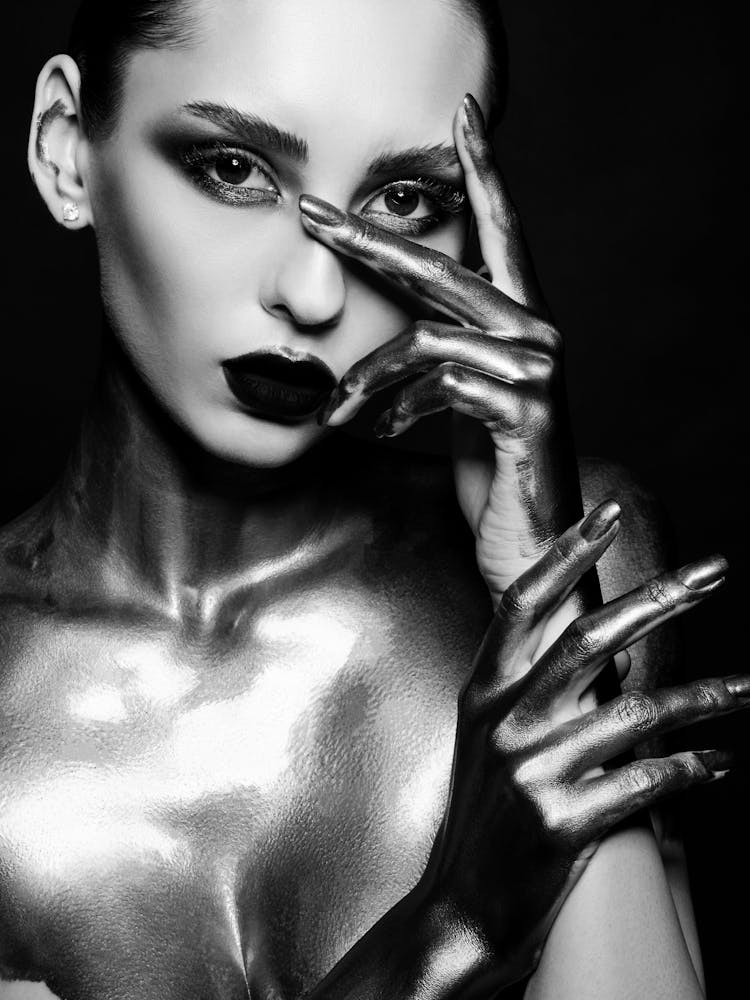 Black And White Portrait Of A Woman With Silver Makeup