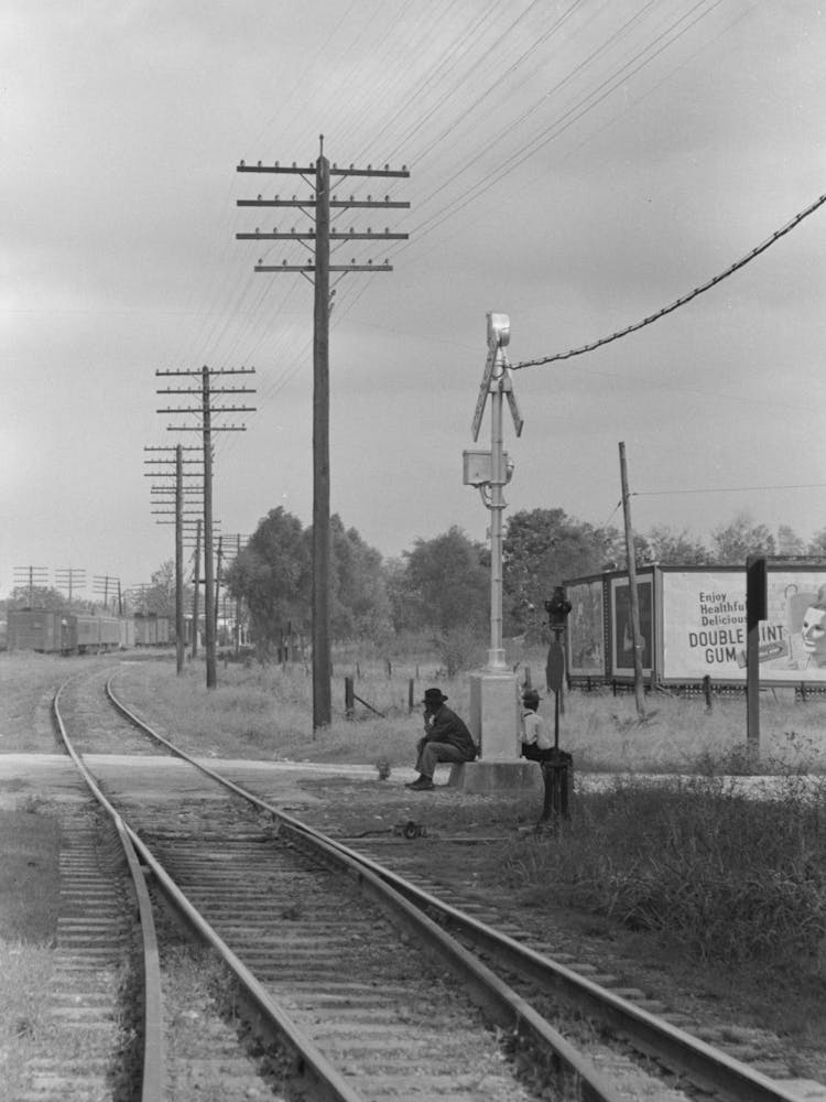 Men Sitting On Signal Tower Beside Railroad Track, Morgan City, Louisiana By Russell Lee
