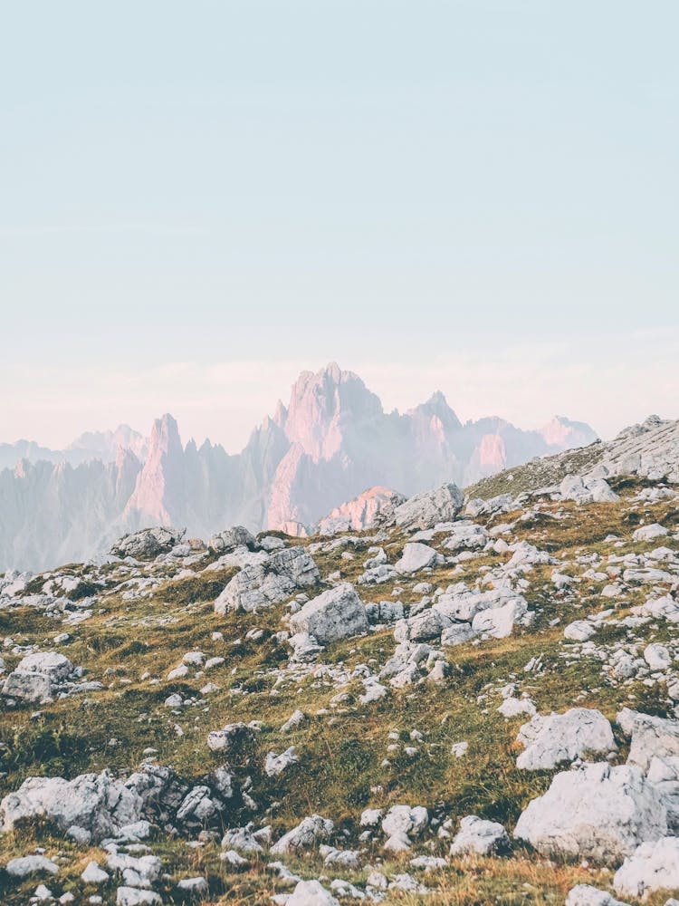Dolomites, Italy I Alpine mountain scenery view from the Tre Cime at sunrise in golden pink light with boho bohemian wilderness and rocky grandiose skylines panorama photography like those of Canada or Norway