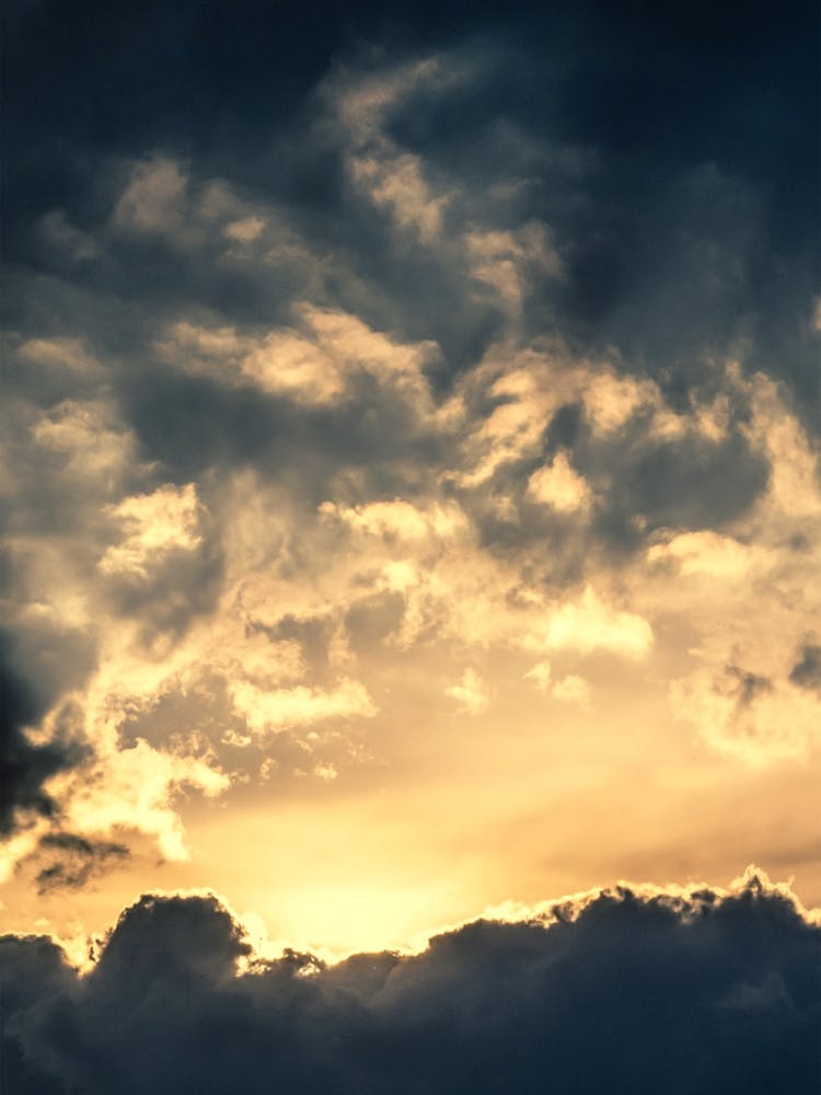 The Sky. Sunlight Through Dark Clouds.