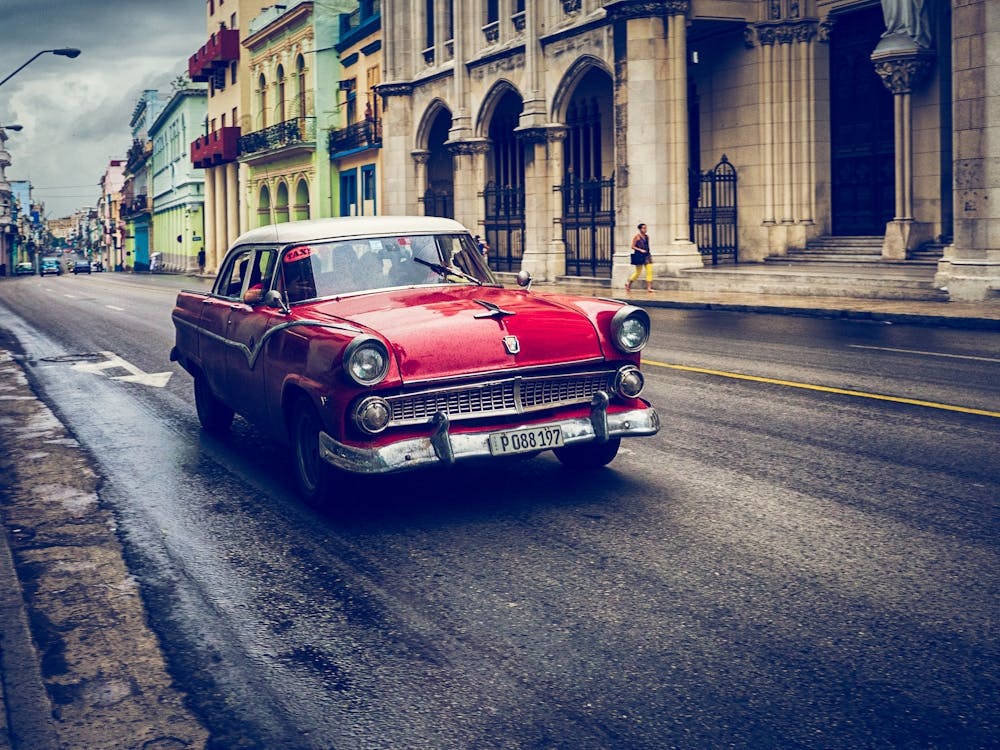Red Car Driving Urban Havana