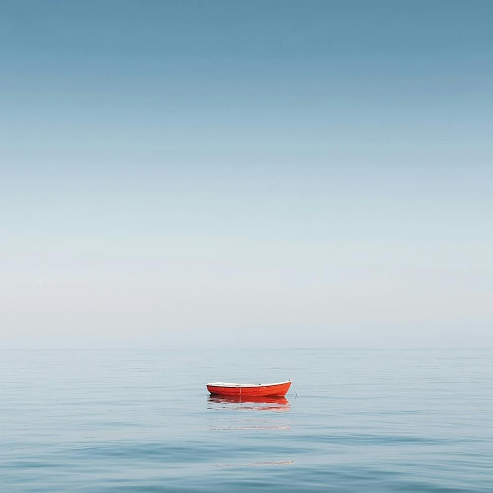Red Boat In The Ocean 1