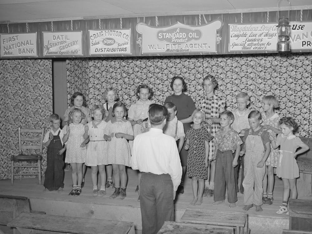 Children At The Private School Held In The Farm Bureau Building Keeping Time With Homemade Musical Instruments With A