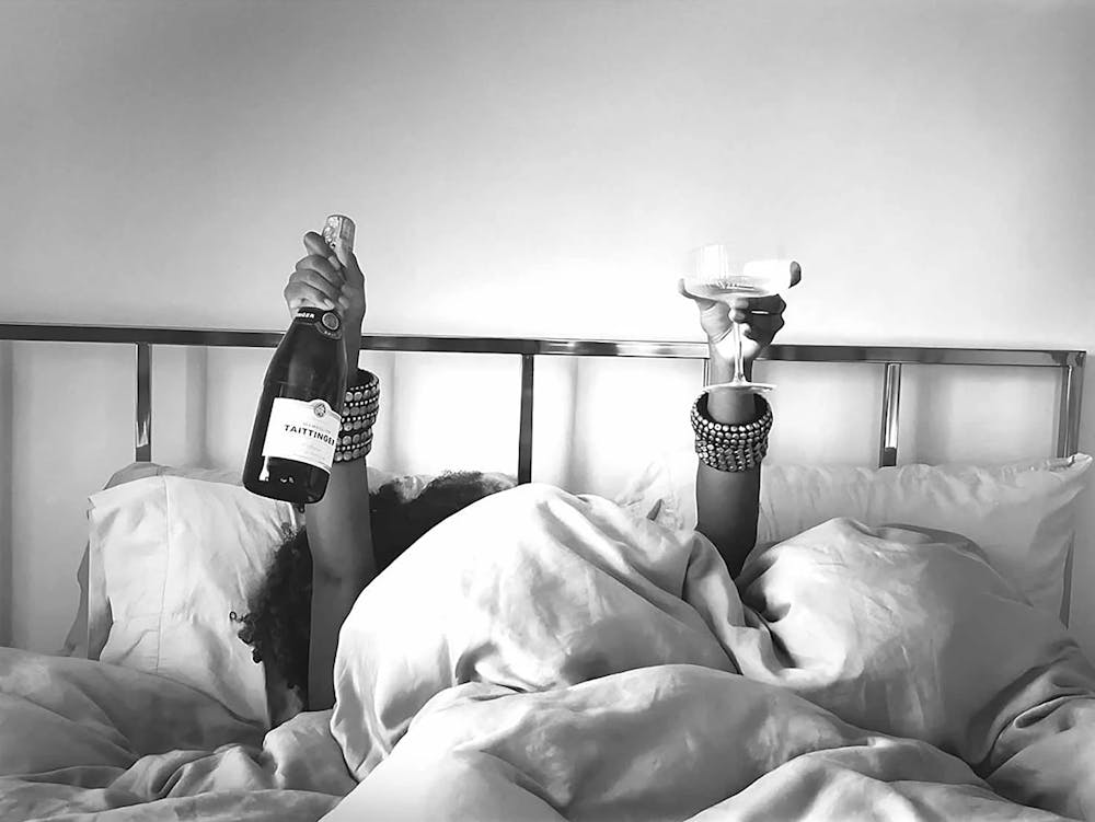 Woman Drinking Wine In Bed