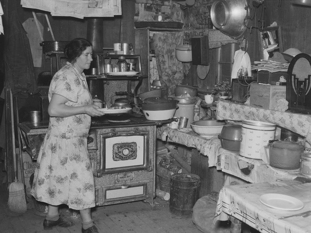Mrs Ole Thompson, Wife Of Farmer, Carrying Food To The Table, Williams County, North Dakota By Russell Lee