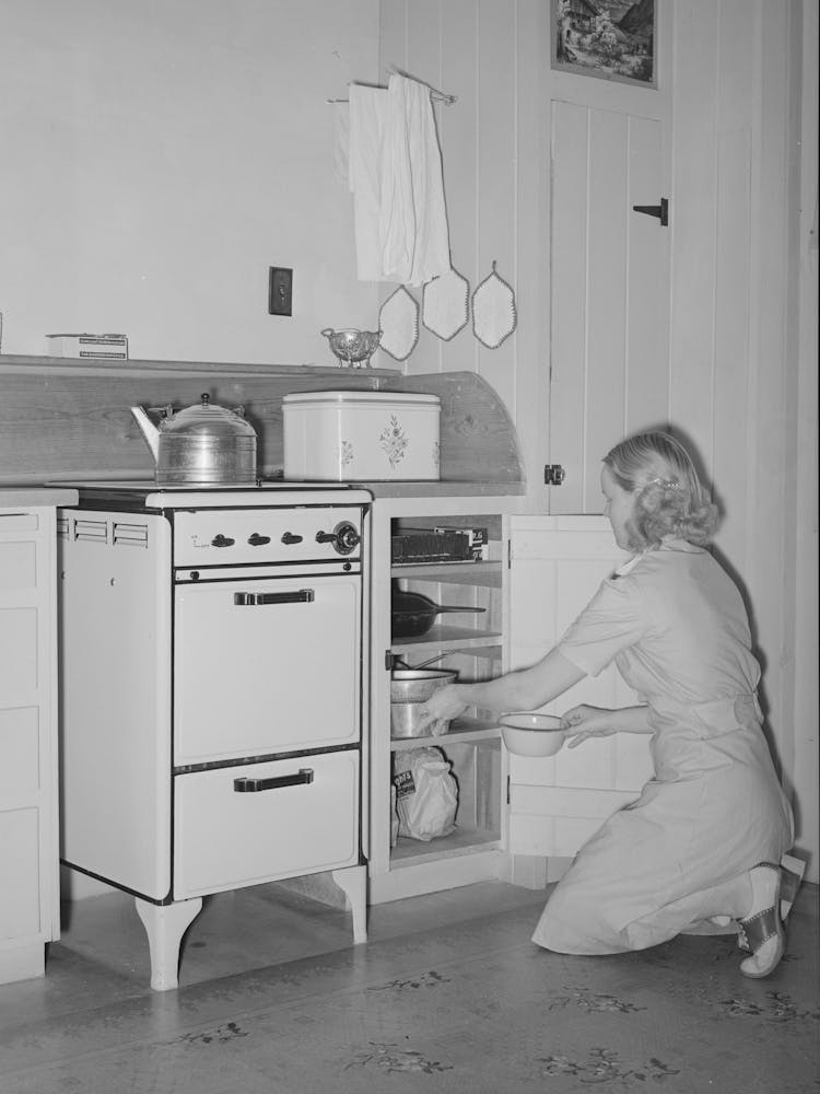 Wife Of Member Of The Arizona Part Time Farms, Chandler Unit, Maricopa County, Arizona, At Her Kitchen Stove By Russe