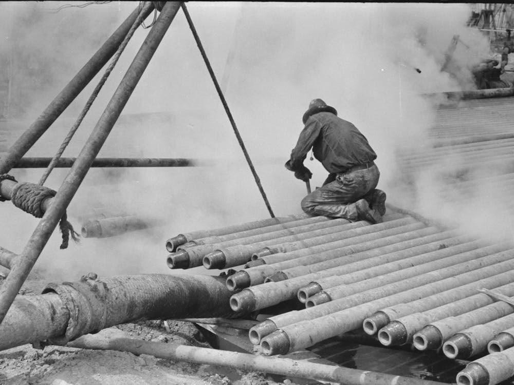 Oil Field Worker, Probing In Slush Pit, Kilgore, Texas By Russell Lee