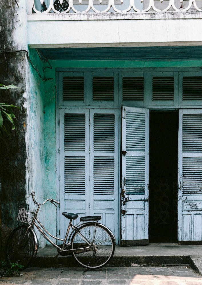 Blue Door And Bicycle In Hoi An Vietnam