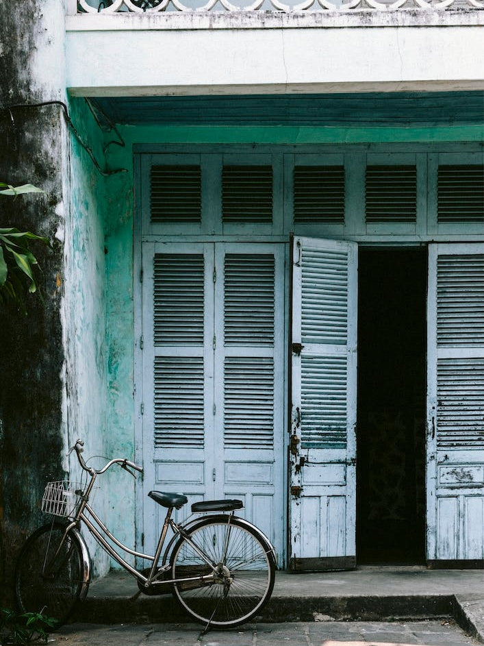 Blue Door And Bicycle In Hoi An Vietnam