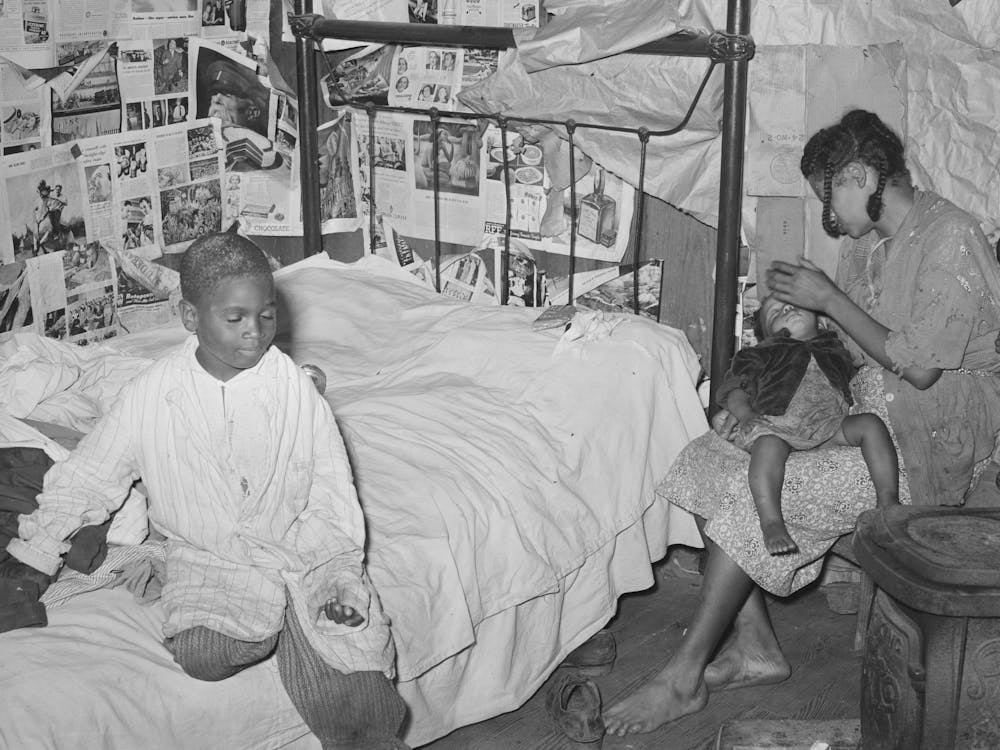 Mother And Two Children In House Provided For Workers In Strawberry Fields Near Independence, Louisiana By