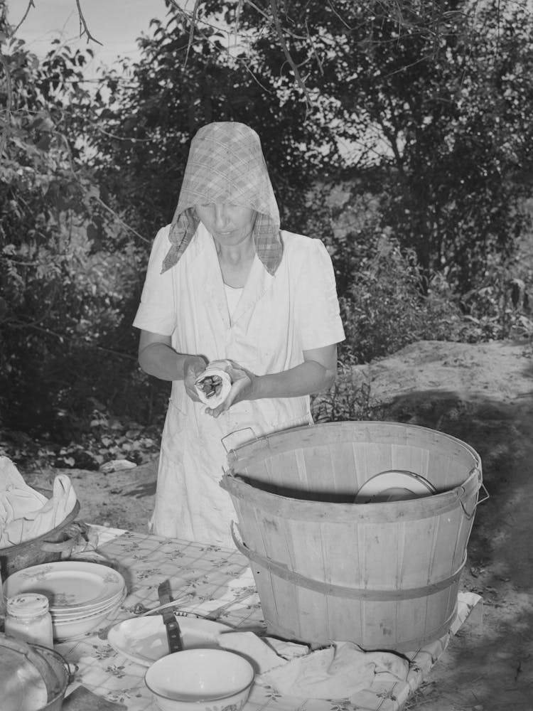 Untitled Photo, Possibly Related To Packing Dishes And Silverware Preparatory To Departure For California