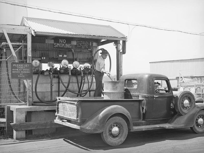 Member Of The United Producers And Consumers Cooperative Having A Drum Filled With Gasoline At The Warehouse