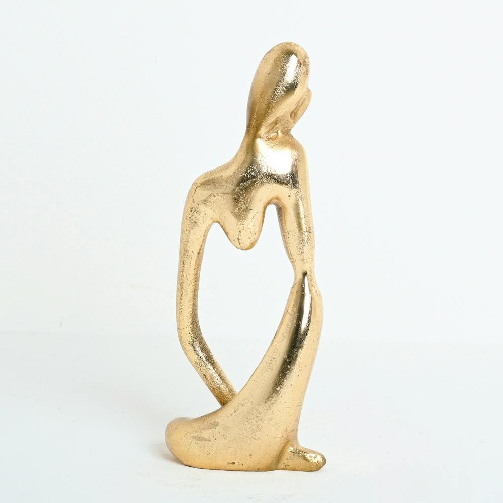 Gold Sculpture Of A Woman