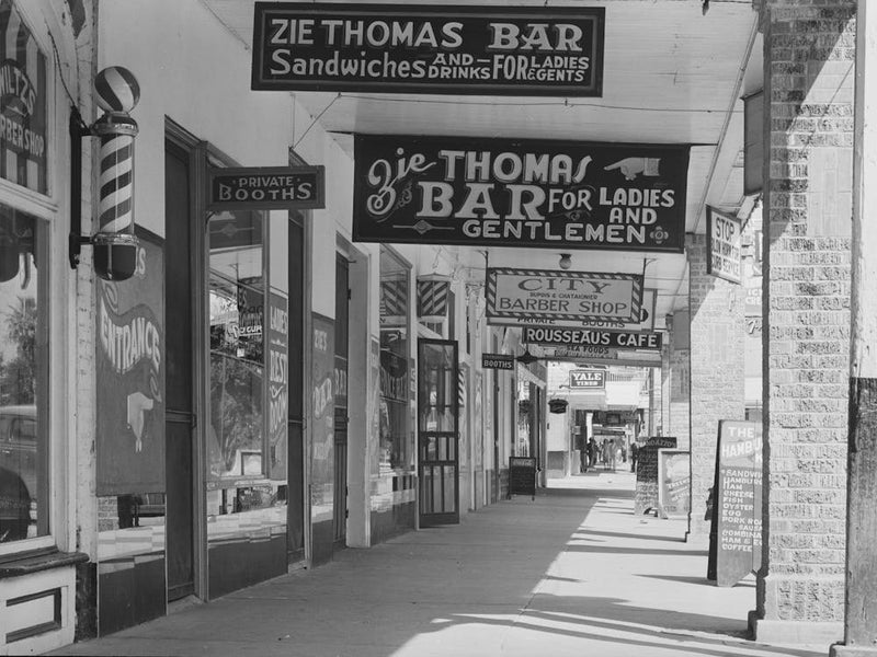 Signs On Main Street Of Saint Martinville, Louisana, Under Overhanging Balcony, These Overhanging Balconies Are A