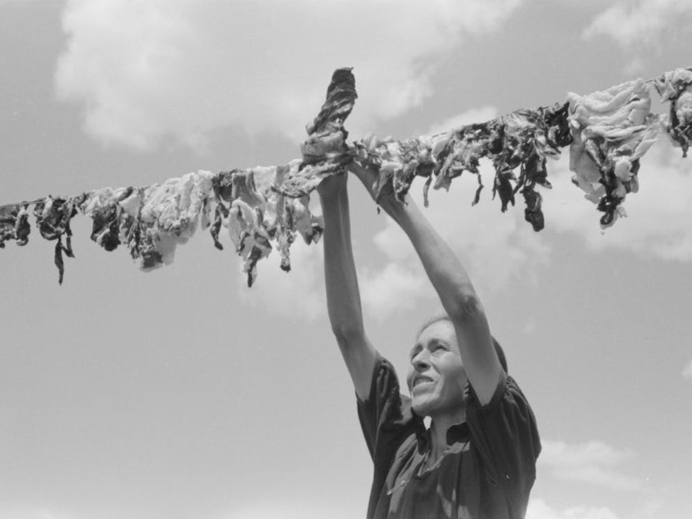 Spanish American Woman Hanging Up Meat To Dry, Chamisal, New Mexico By Russell Lee