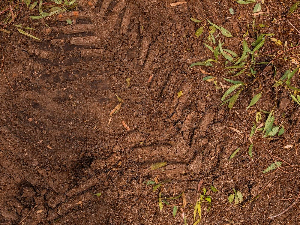 Texture Of Brown Mud With Tractor Tyre Tracks 4