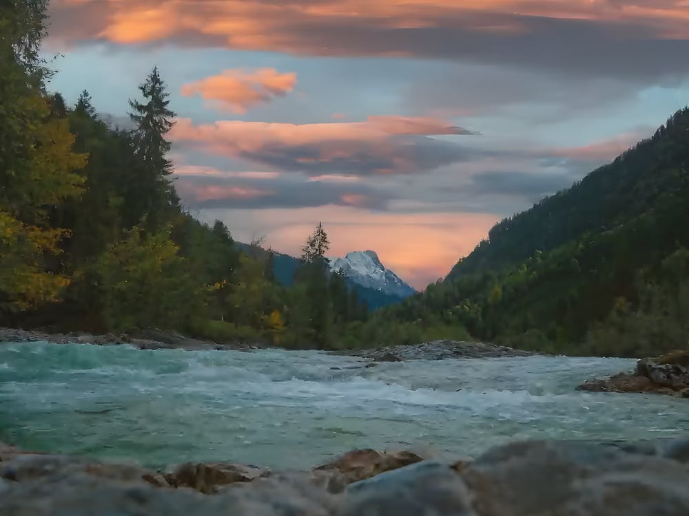 The Sunset Deposits Water And Mountains