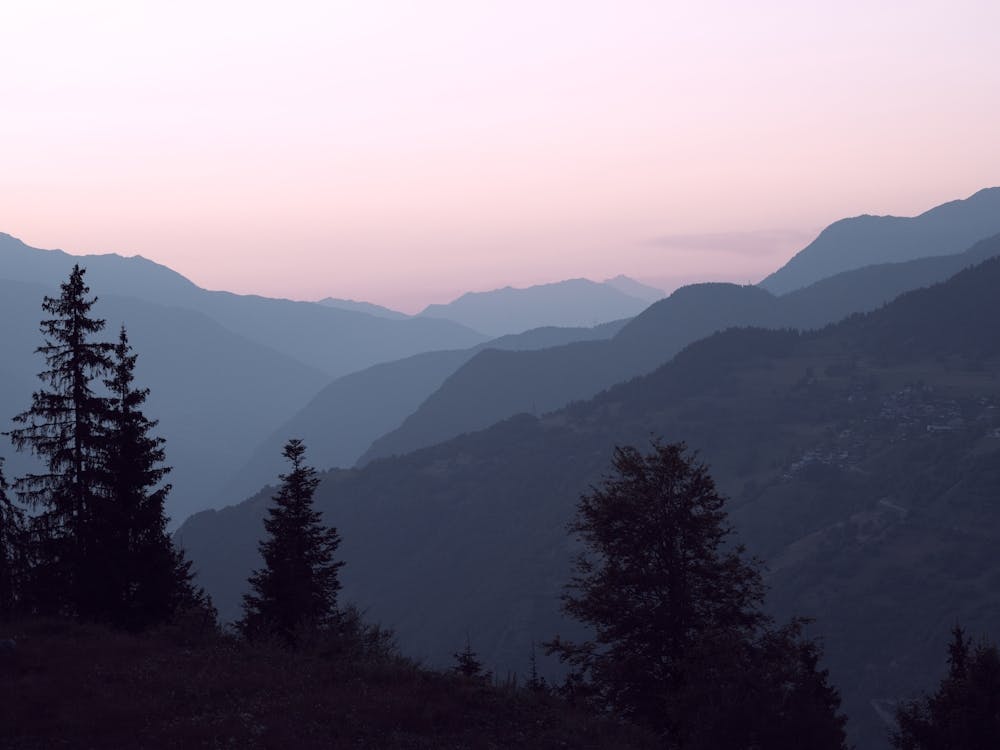 Pastel pink sunrise in the mountains of the french alps - Courchevel in France, nature and travel photography by Christa Stroo Photography