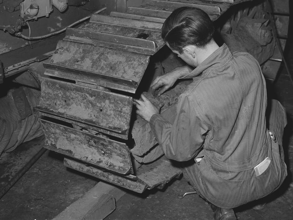 Repairing Caterpillar Tractor In Repair Shop At Colfax, Washington By Russell Lee