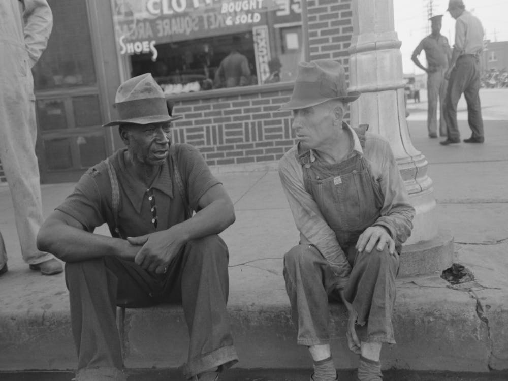 Men Sitting On Curb Talking, Muskogee, Oklahoma By Russell Lee