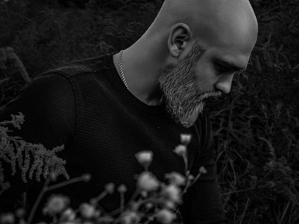 Black And White Brutal Portrait Of A Bald Man With A Beard