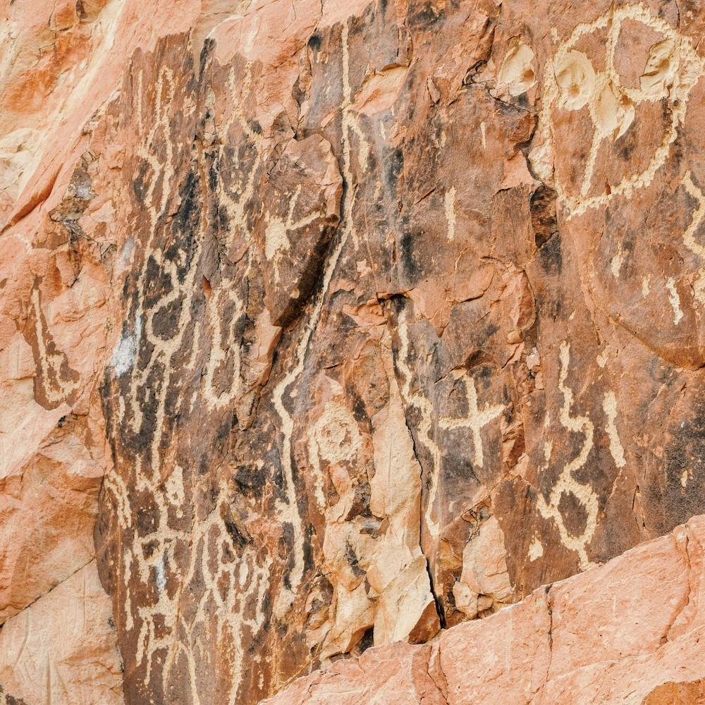 Petroglyphs On Rock Square