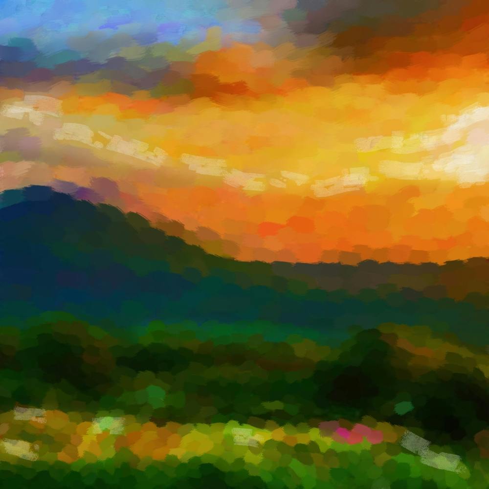 Green hills and orange sunset