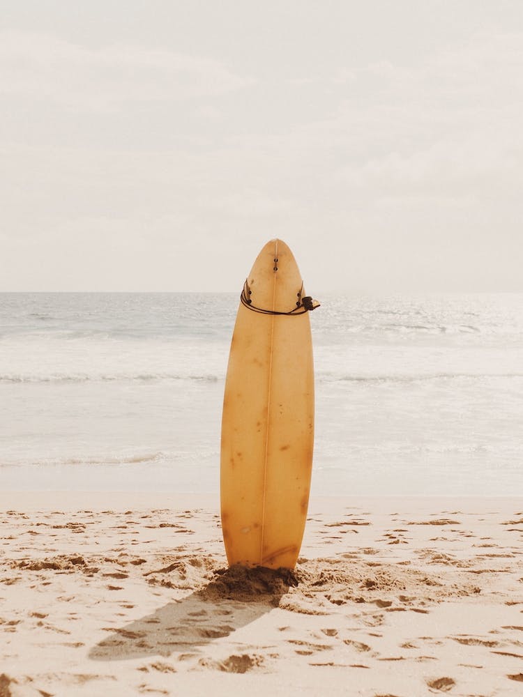 Yellow Surfboard On Beach