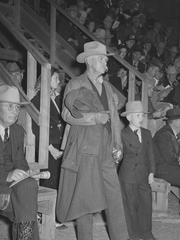 Cattleman With His Grandson At Auction Of Beef Steers And Breeding Stock At The San Angelo Fat Stock Show