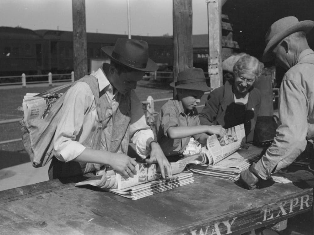 Newsboys Getting The Papers Just After The Arrival Of The Morning Train, Montrose, Colorado