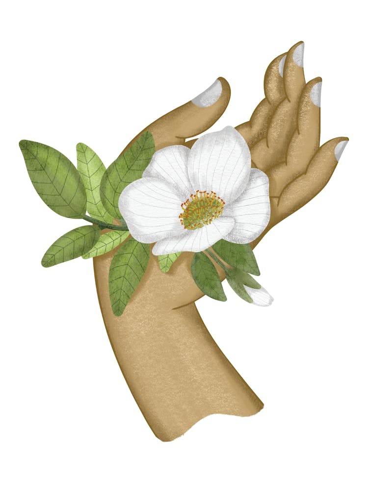 Dainty white flower on a woman hand