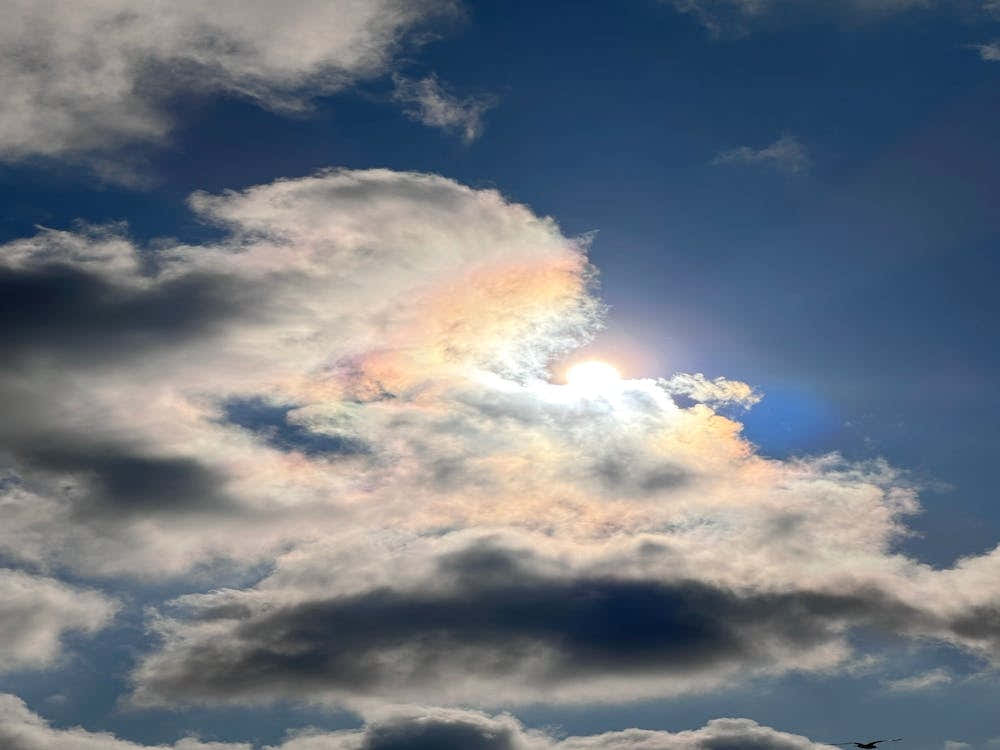 Sun Shining Through Clouds Photo