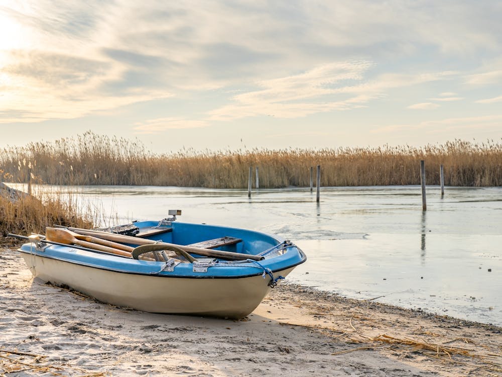 Blue Rowing Boat On The Shore