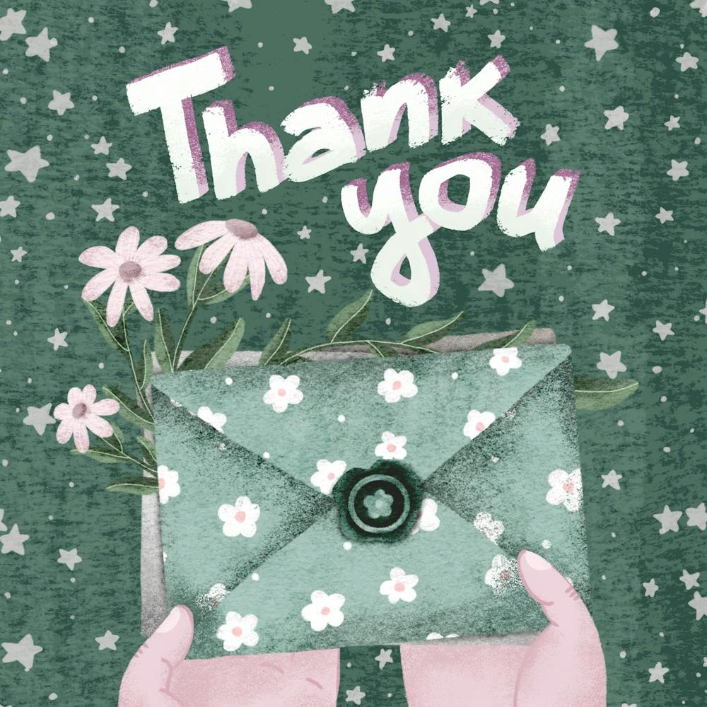 Hand holding thank you letter